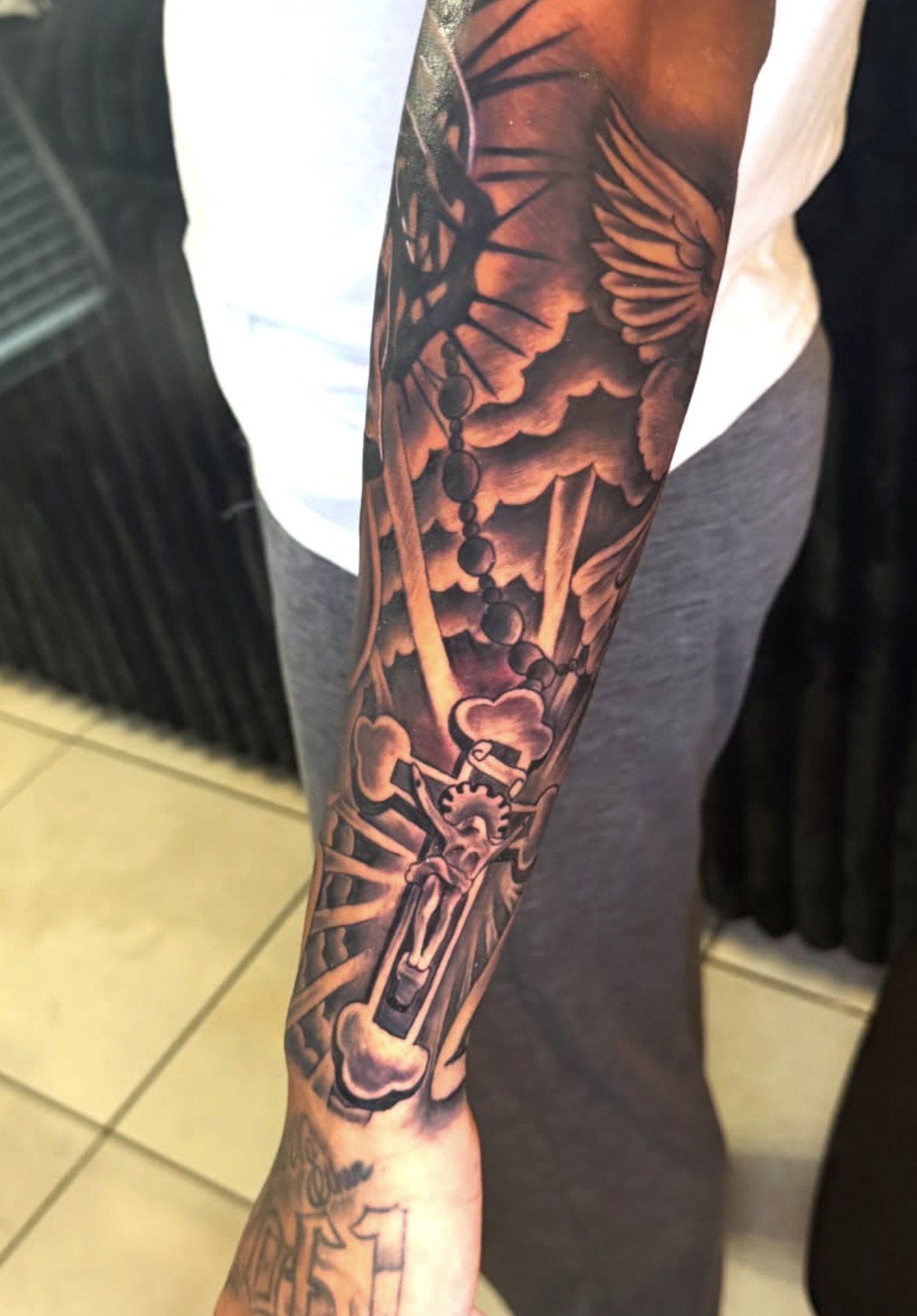 Black and gray rosary and clouds forearm sleeve by Erick